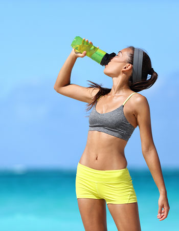 runner athlete drinking alkaline, ionized water
